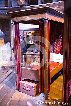 Interior of student`s bedroom. Harry Potter`s bed. Decoration Warner Brothers Studio. UK Editorial Stock Photo