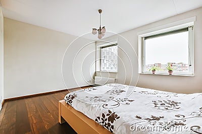 The interior of a stunning bedroom with a wooden bed Stock Photo