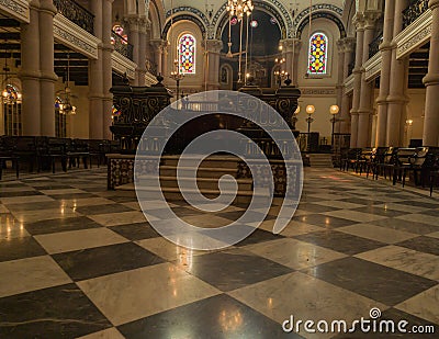 Interior of a synagogue with bimah in middle. Synagogue is Jewish house of worship for the purpose of Jewish prayer, study, Editorial Stock Photo