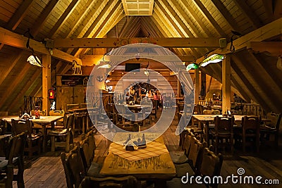 Interior of traditional Polish wooden restaurant in Bialka Tatrzanska Editorial Stock Photo