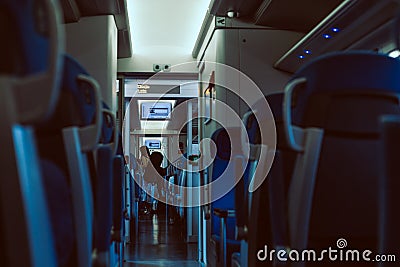 Interior of the train wagon with passenger in the background Editorial Stock Photo