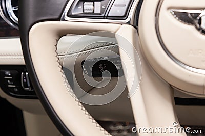 Interior view with cruise-control of luxury very expensive new black Bentley Bentayga car stands in the washing box waiting for Editorial Stock Photo