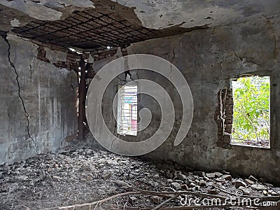 interior view of ruins of a building in poorly maintained condition Stock Photo