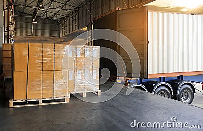 Interior of warehouse dock, Large pallet shipment goods, truck docking load cargo at warehouse Stock Photo