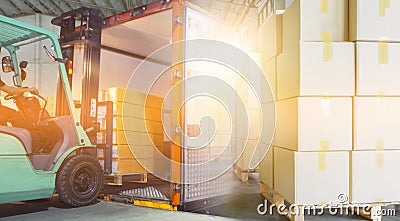 Interior of warehouse dock, Forklift loading pallet into contain, truck docking load cargo at warehouse Stock Photo