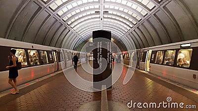 Interior of a WMATA subway station platform with passengers and two trains Editorial Stock Photo