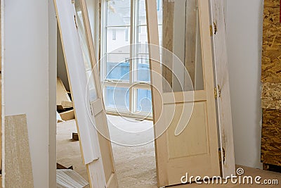 Interior wooden doors are waiting for installation in the house they built Stock Photo