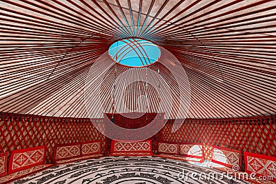 Interior of Yurt. It is a portable tent house in the culture of Central Asian nomadic peoples. Ethnic and folk patterns for home Stock Photo