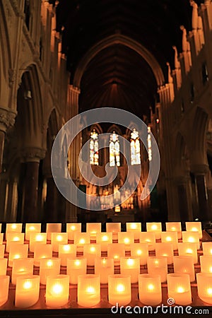 Interiors of St. Finbarr`s Cathedral - Candles lit - Irish religious tour - Ireland travel Stock Photo