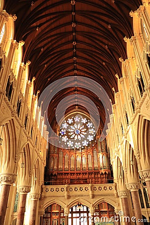 Interiors of St. Finbarr`s Cathedral - stained glass design and wooden ceiling - Irish religious tour - Ireland travel Editorial Stock Photo