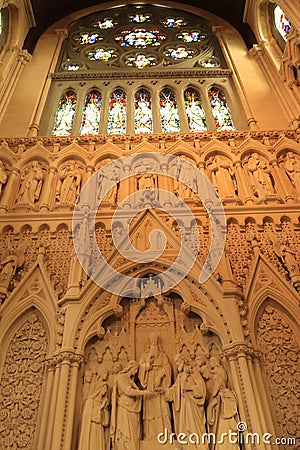 Interiors of St. Finbarr`s Cathedral-stained glass windows and carvings of biblical characters-Irish religious tour-Ireland travel Stock Photo