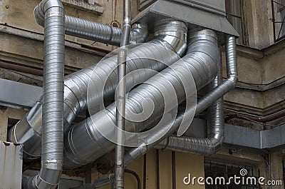 Interlacing of silver air ducts of different diameters Stock Photo
