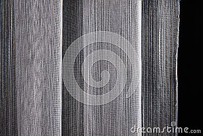 Interlacing of threads of fabric white sample for curtain on black background Stock Photo