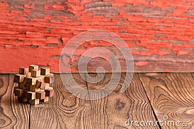 Interlocked wooden puzzle on a rustic background Stock Photo