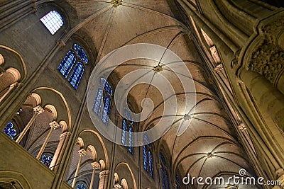 Internal ceiling of the Notre Dame de Paris and beautiful blue mozaic windows. Stock Photo