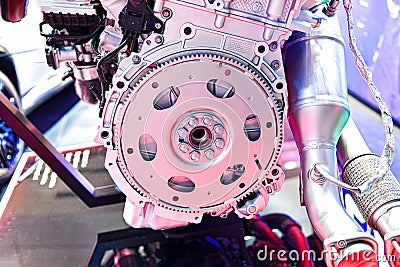 An internal combustion engine flywheel assembly on a store display case Stock Photo