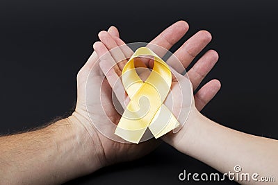 International Children`s Day Cancer. Yellow ribbon Stock Photo