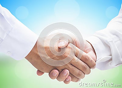 International Co-operative Day Concept: Business Persons Handshake Together Peacefully Stock Photo