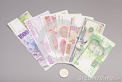 International currencies and euro coin Stock Photo