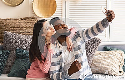 International family makes selfie and blowing lips Stock Photo