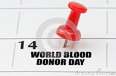 On the calendar grid, the date and name of the holiday - World Blood Donor Day Stock Photo