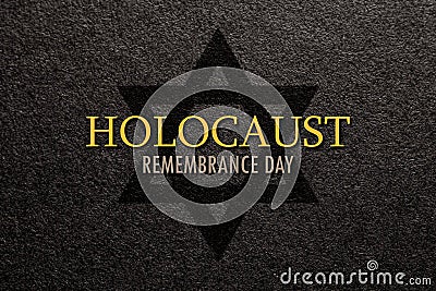 International Holocaust Remembrance Day. Star of David on a black background. Editorial Stock Photo