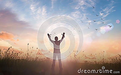 Slave hands broken chains with bird flying Stock Photo