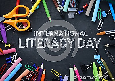 International Literacy Day. School Stationary Top View on Blackboard Stock Photo