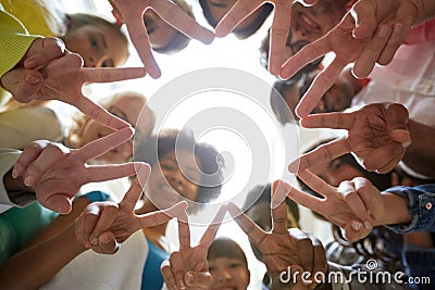 International students showing peace or v sign Stock Photo