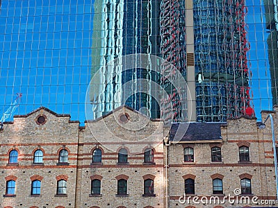 Skyscraper Tower Reflected in Glass Building Facade Stock Photo