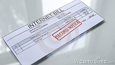 Internet bill second notice, seal stamped on document, payment for services Stock Photo