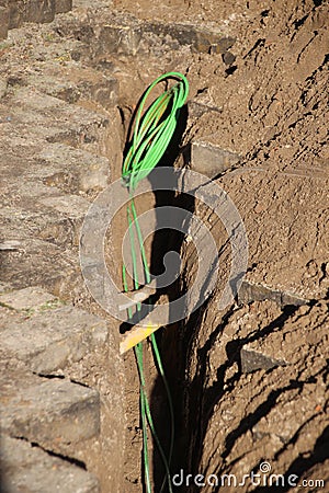 Internet and cable coax cables replaced by glass fiber to speed up connection in Gouda the Netherlands. Editorial Stock Photo