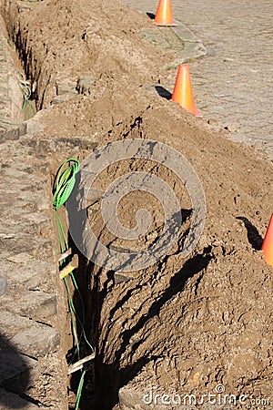 Internet and cable coax cables replaced by glass fiber to speed up connection in Gouda the Netherlands. Editorial Stock Photo