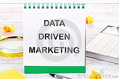 Internet concept. Business concept. Business idea. DATA DRIVEN MARKETING text on a blank sheet in a notebook Stock Photo