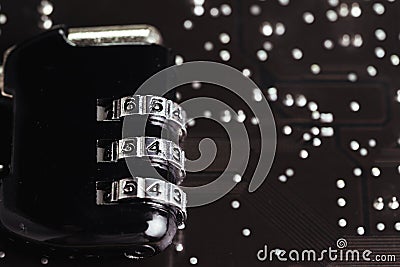 Internet safety and security for digital cyber concept, code numbers combination pad lock on computer circuit board with solder Stock Photo