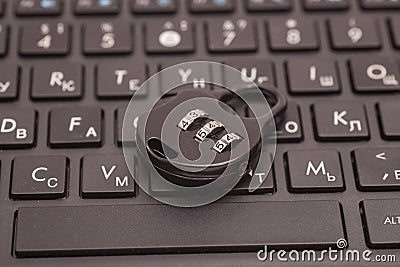 Internet security concept : black padlock on black keyboard Stock Photo