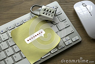 Internet and security concept with a padlock, computer keyboard and yellow paper with a password Stock Photo