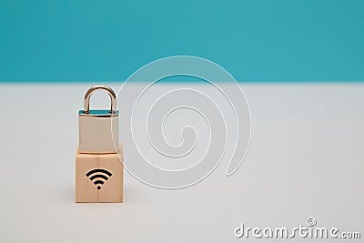 Internet security. Data safety. Wireless internet safeguard. Network under guard. Wooden cube, lock on top, wifi sign Stock Photo