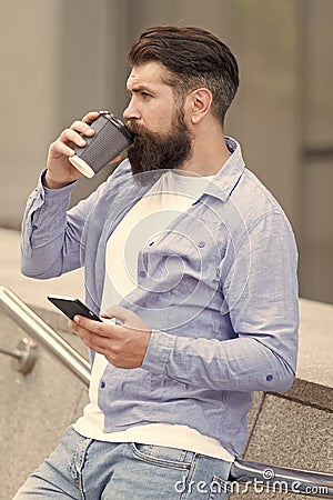 Internet surfing social networks with smartphone. Energy. Coffee time. Waiting for message. Modern life. Man with Stock Photo