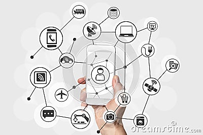 Internet of things concept with hand holding modern smart phone Stock Photo