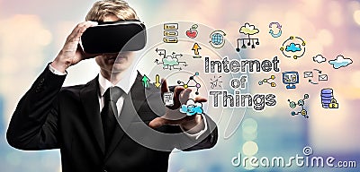 Internet of Things text with businessman using a virtual reality Stock Photo