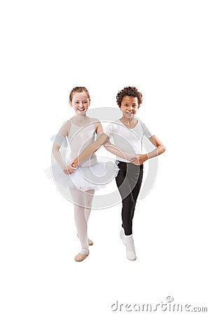 Interracial children dancing together Stock Photo