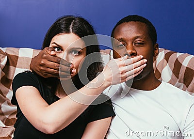 Interracial couple, man and woman not tell secret Stock Photo
