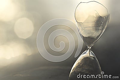 Interruption of time measurement in a broken hourglass Stock Photo