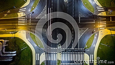 intersection at night from the drone wet road, road lighting wet road, road lighting cars road lanes Stock Photo