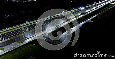 intersection at night from the drone wet road, road lighting Stock Photo