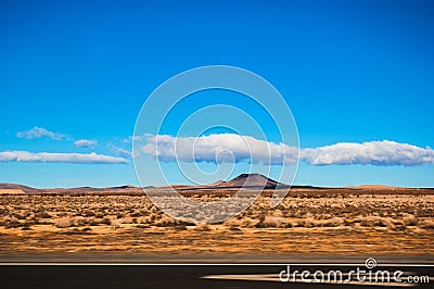 Interstate 15 highway from California to Nevada pass through Mojave desert. Stock Photo