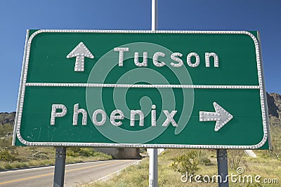 A interstate highway sign in Arizona directing traffic to Tucson and Phoenix, AZ Stock Photo