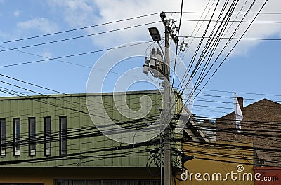 Intertwining of many telecomunication and electrical wires Stock Photo