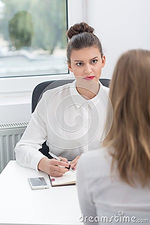 Interview with demanding boss Stock Photo